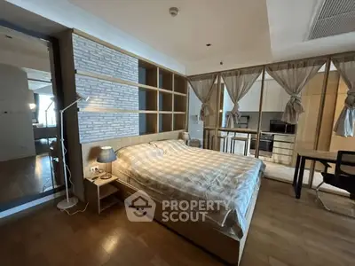 Modern bedroom with open kitchen layout and stylish decor