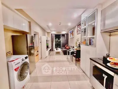 Modern kitchen with sleek appliances and open layout in a stylish apartment.