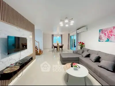 Spacious modern living room with elegant decor and open dining area