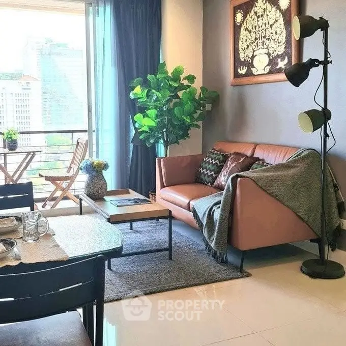 Stylish living room with modern decor and city view balcony.