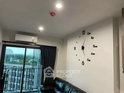 Modern living room with unique wall clock and balcony view