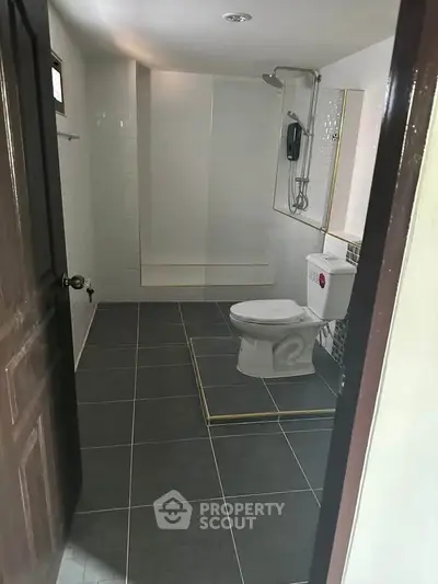 Modern bathroom with sleek design and tiled flooring
