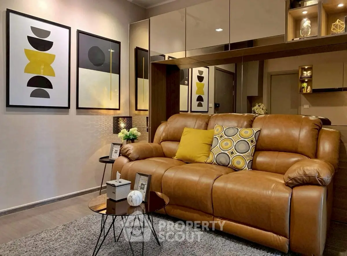 Stylish living room with modern decor and cozy leather sofa, perfect for relaxation and entertaining.