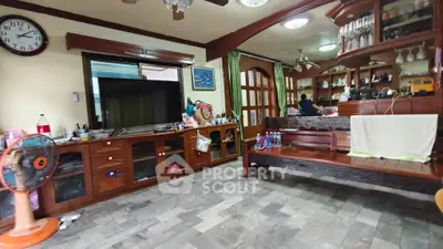 Spacious living room with wooden furniture and modern decor