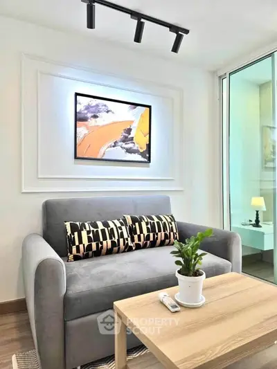 Modern living room with stylish sofa and abstract art, featuring a cozy ambiance and elegant decor.