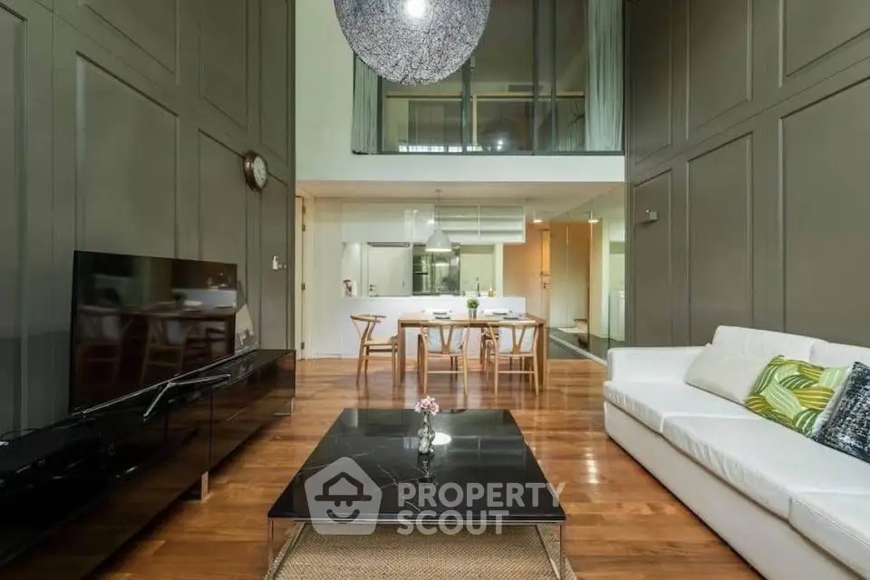 Luxurious modern living room with high ceilings and elegant decor