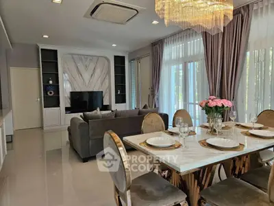Luxurious living and dining area with elegant decor and natural light