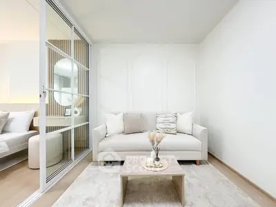 Modern living room with cozy sofa and elegant decor in a bright apartment.
