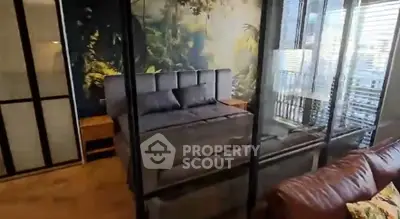 Luxurious bedroom with glass walls and nature-themed decor