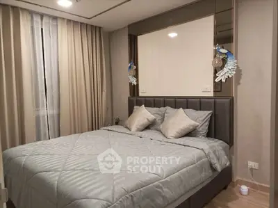 Elegant bedroom with plush bedding and stylish decor in modern apartment