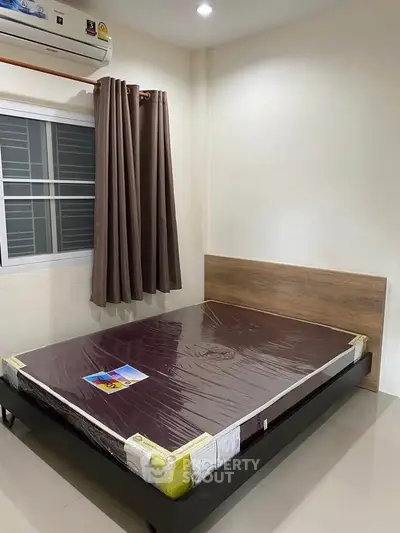 Modern bedroom with new bed and air conditioning in a cozy apartment