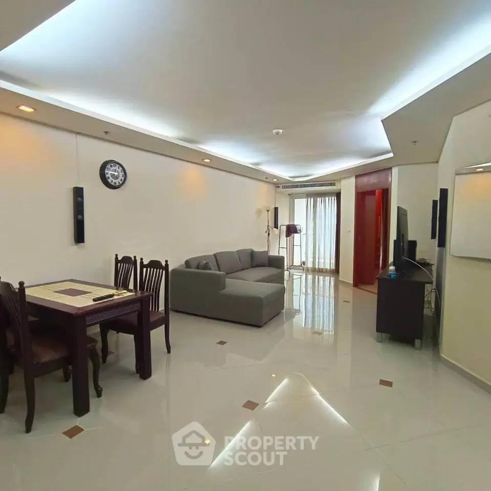 Spacious modern living room with elegant dining area and sleek furniture