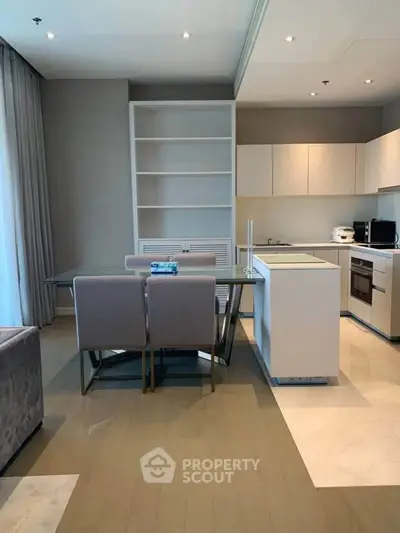 Modern open-layout kitchen with dining area and sleek cabinetry