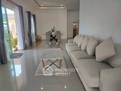 Spacious modern living room with elegant decor and natural light
