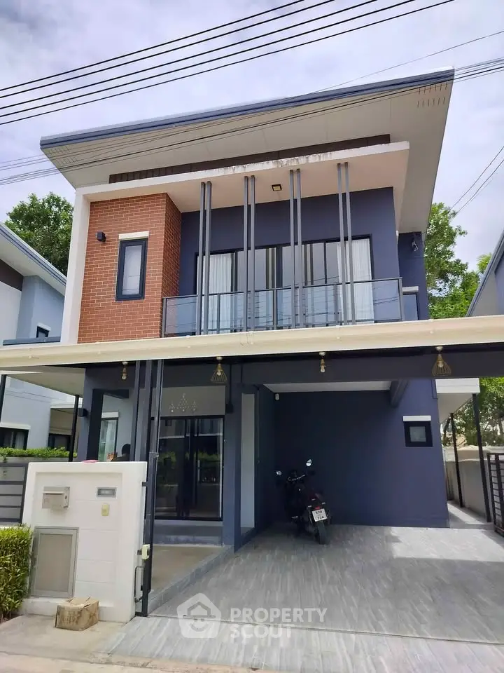 Modern two-story house with sleek design and spacious carport in a suburban neighborhood.