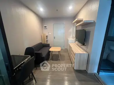 Modern living room with sleek furniture and stylish decor in a contemporary apartment.