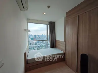 Cozy bedroom with stunning city view and modern wooden furnishings