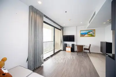 Spacious modern living room with balcony and stylish decor