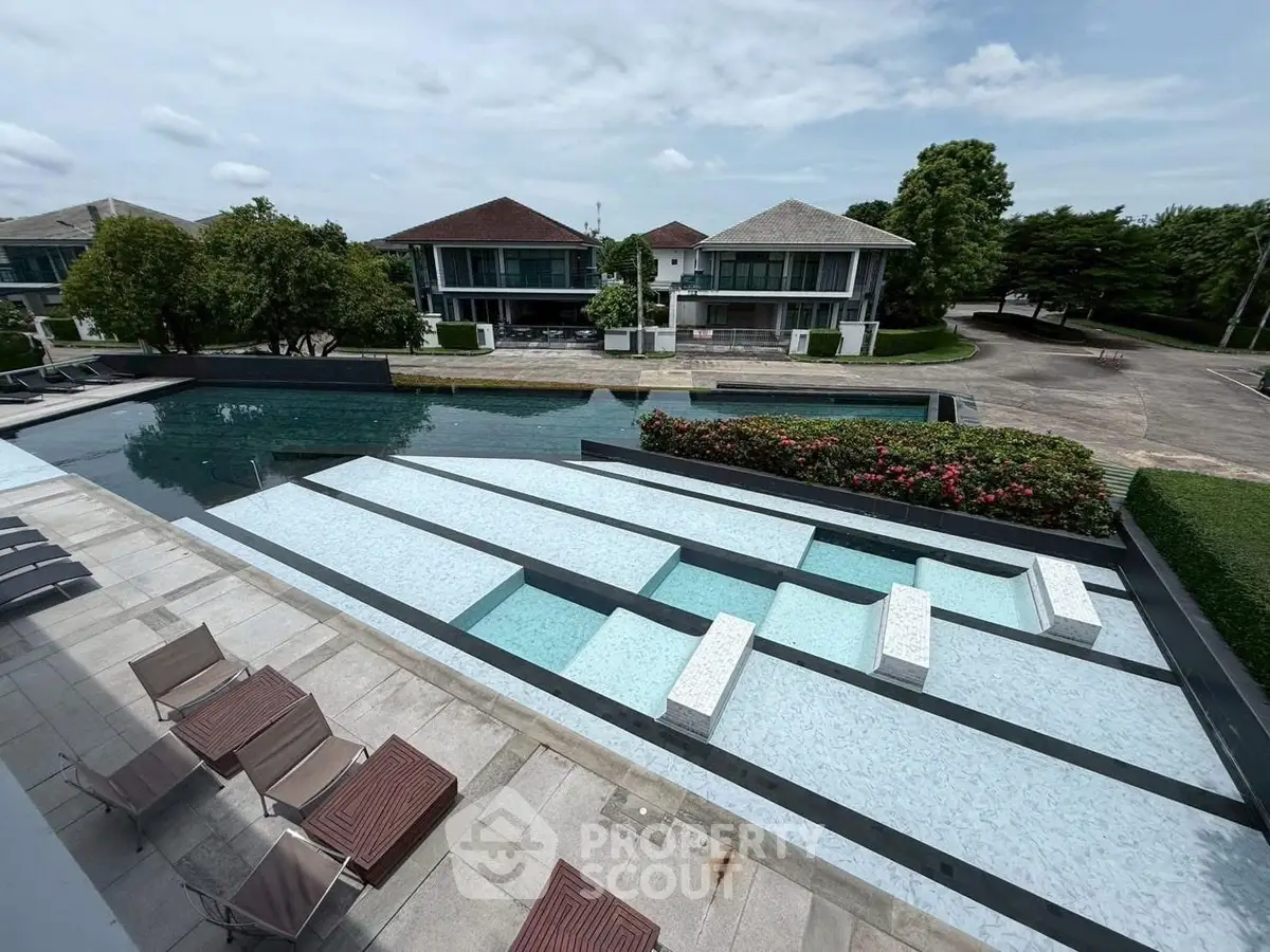 Luxurious residential complex with modern pool and elegant architecture, perfect for upscale living.