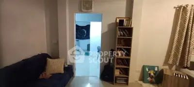 Cozy living room with bookshelf and modern decor