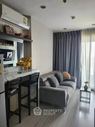Modern living room with cozy sofa and stylish decor in a bright apartment