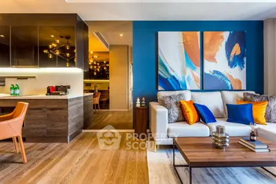 Modern living room with vibrant decor and open kitchen layout