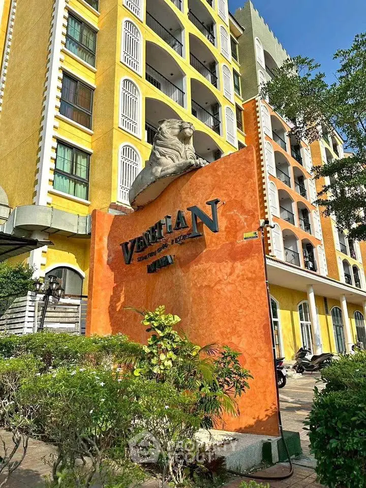 Stunning exterior view of Venetian building with vibrant colors and elegant architecture.