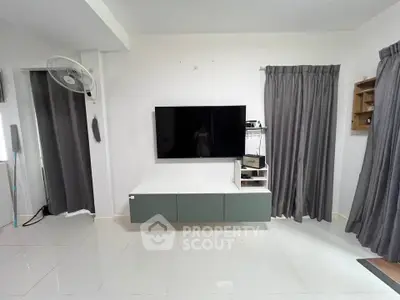 Modern living room with sleek TV setup and minimalist decor