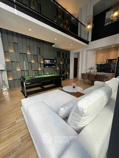 Luxurious modern living room with high ceilings and stylish decor