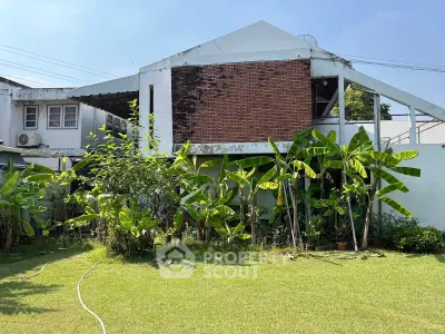 Charming house with lush garden and unique architectural design