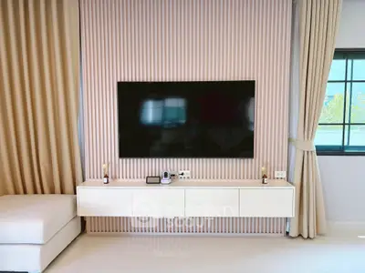 Modern living room with sleek TV setup and elegant decor