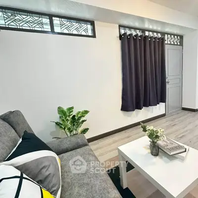 Modern living room with stylish decor and cozy seating area