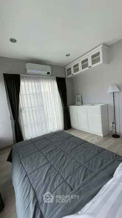 Modern bedroom with sleek design and natural light
