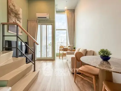 Modern duplex living room with high ceilings and large windows offering city views.