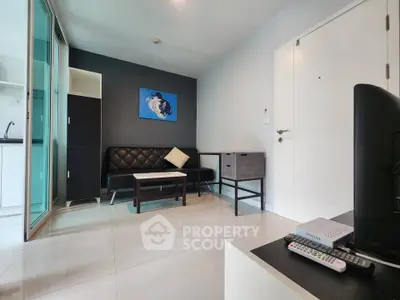 Modern living room with sleek furniture and stylish decor in a contemporary apartment.