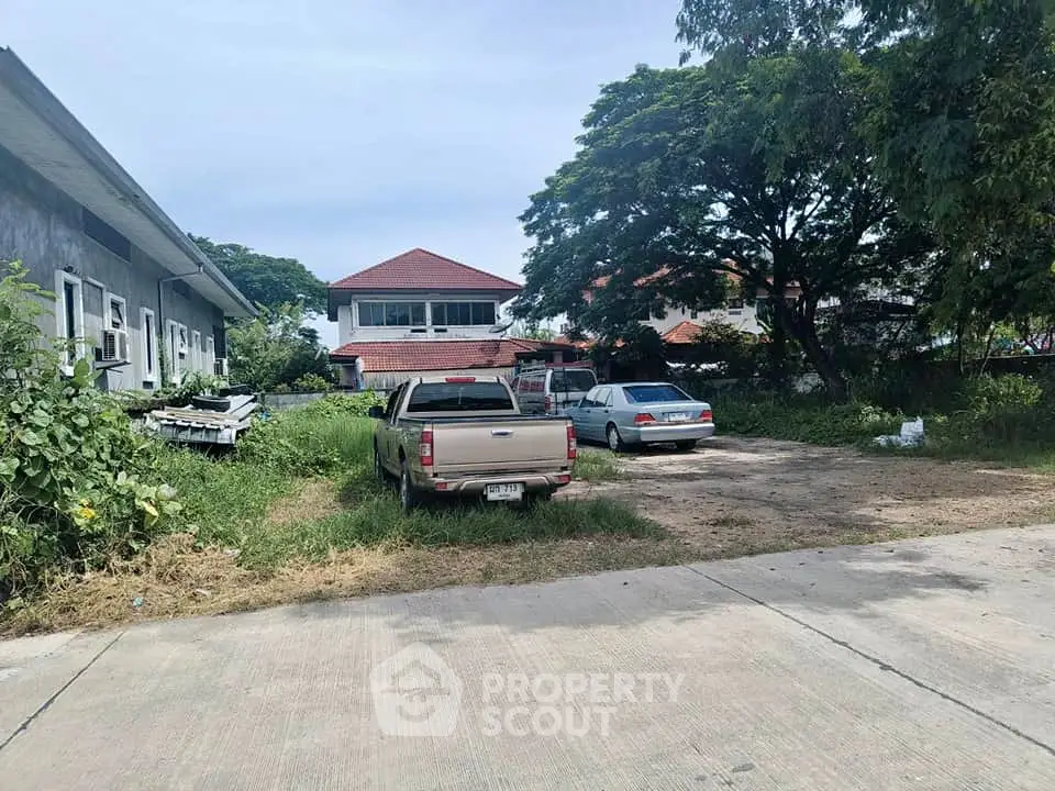 Spacious residential property with ample parking and lush greenery