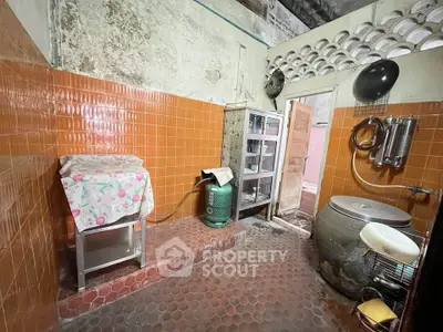 Rustic kitchen with vintage tiles and traditional cooking setup