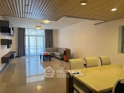 Spacious modern living room with elegant dining area and large windows