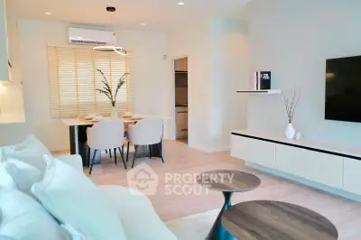 Modern living room with elegant dining area and stylish decor