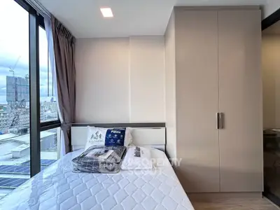 Modern bedroom with city view and sleek wardrobe design