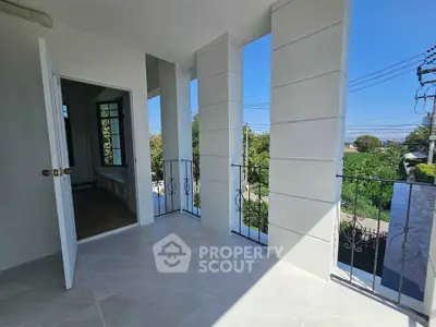 Spacious balcony with scenic view and elegant railing, perfect for relaxation and outdoor enjoyment.