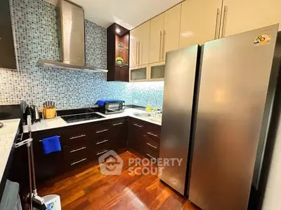 Modern kitchen with stainless steel appliances and stylish cabinetry