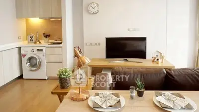 Modern living room with stylish decor and open kitchen layout