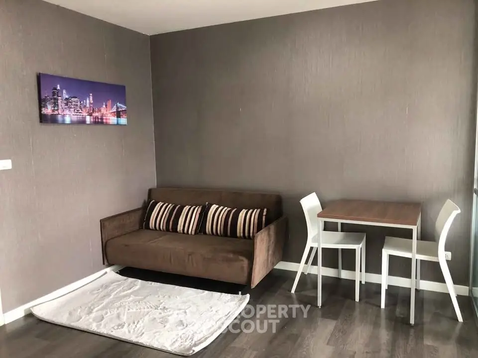 Modern living room with brown sofa and dining table, stylish decor