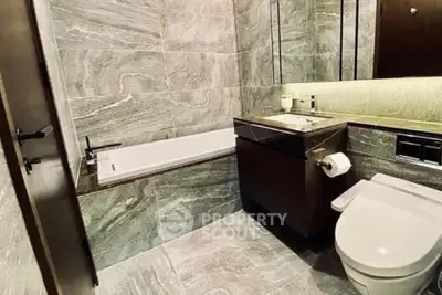 Luxurious modern bathroom with elegant stone tiles and sleek fixtures