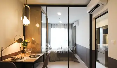 Modern studio apartment with glass partition, stylish dining area, and cozy bedroom.