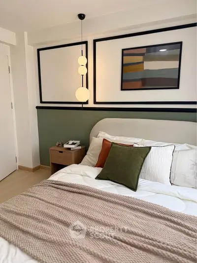 Modern bedroom with stylish decor, featuring a cozy bed, elegant lighting, and contemporary artwork.