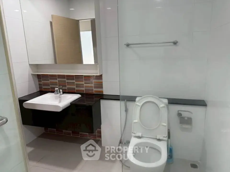 Modern bathroom with sleek fixtures and stylish tile accents
