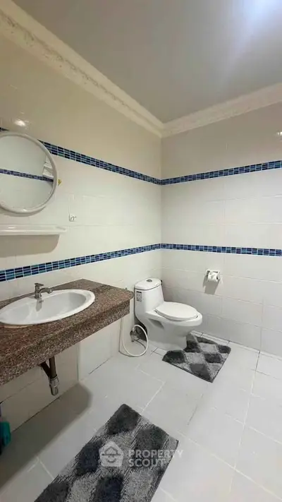 Modern bathroom with sleek fixtures and stylish tile accents