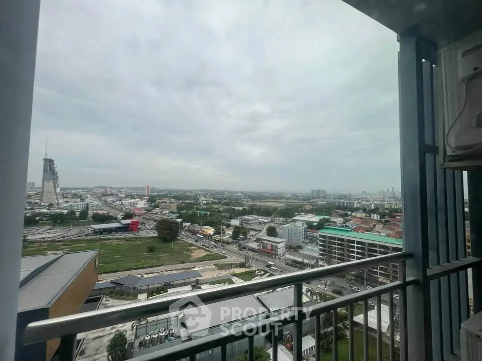 Stunning cityscape view from high-rise balcony with expansive skyline and urban landscape.